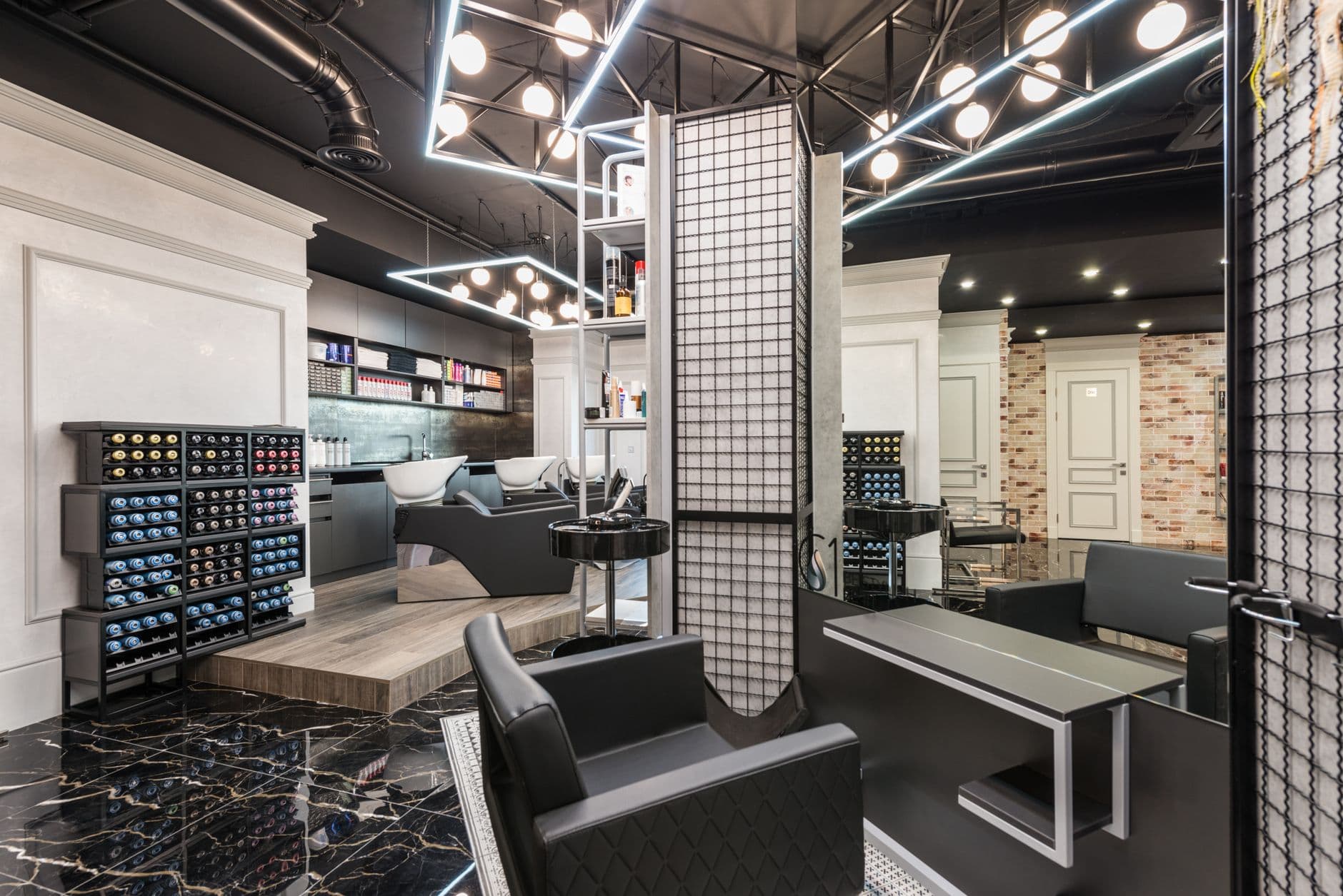 Modern barbershop interior with mirrors and chairs