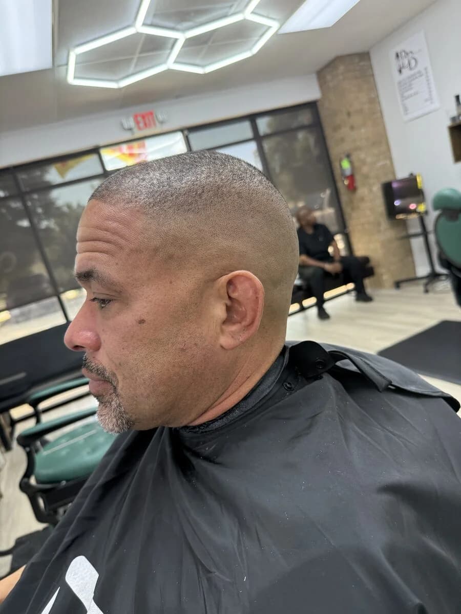 Bold head and beard at Blessed Barbershop — clean buzz with full beard, Daphne AL