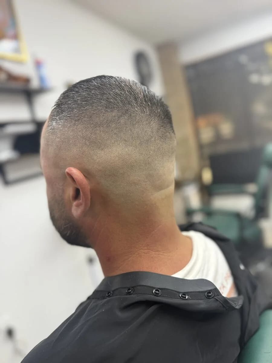 Line up at Blessed Barbershop — crisp skin fade edges, back view, Daphne AL